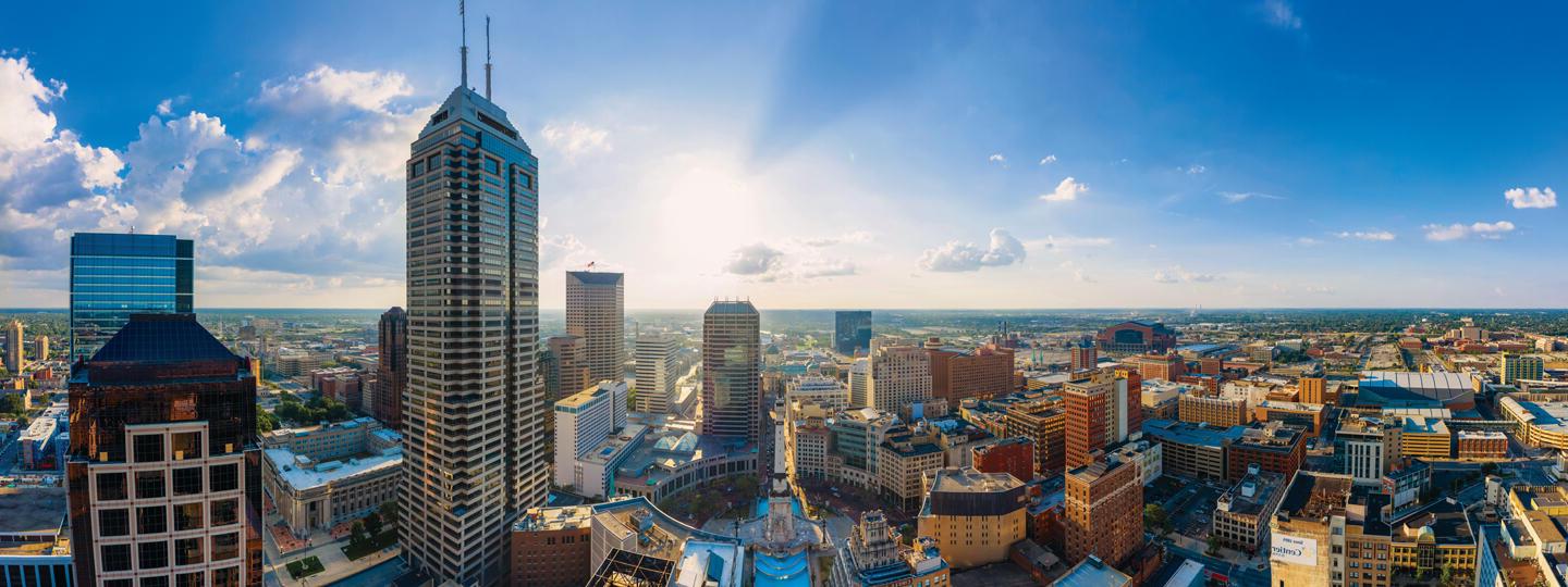 skyline of a city with office buildings and sky scrapers on a sunny day